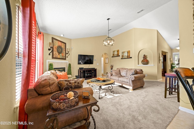 living room with a textured ceiling, visible vents, baseboards, and arched walkways