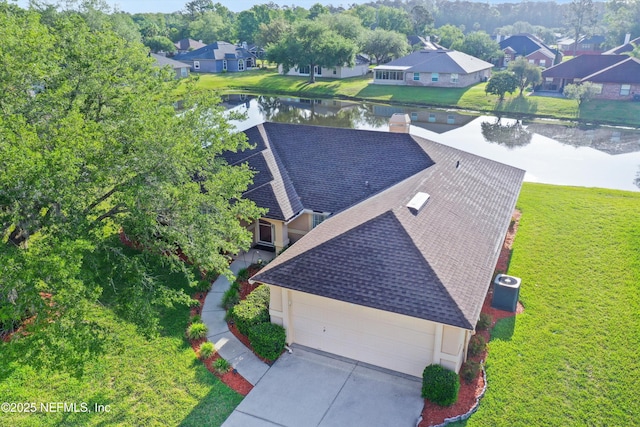 birds eye view of property with a residential view and a water view