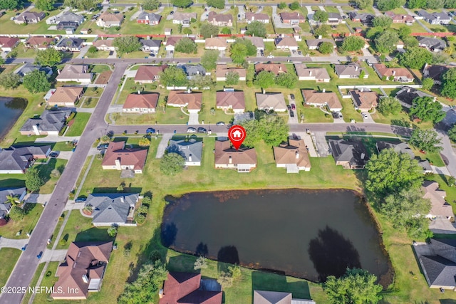 aerial view with a residential view and a water view
