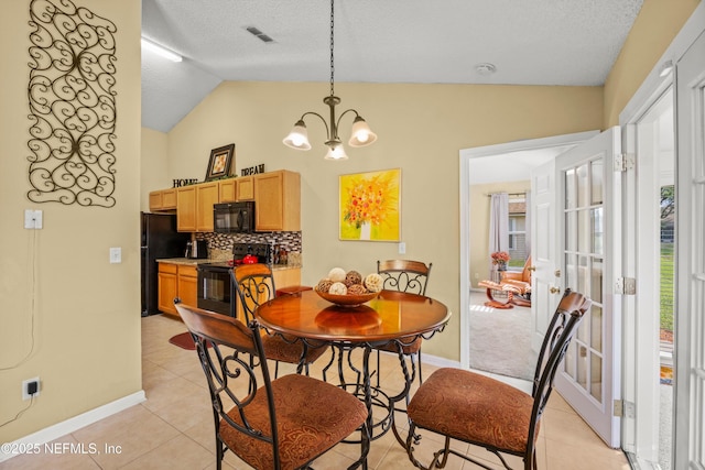 dining room with baseboards, an inviting chandelier, light tile patterned flooring, and vaulted ceiling