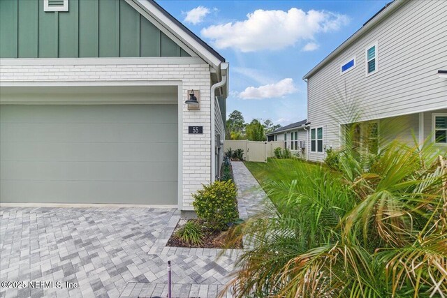55 Cool Springs Ave, Ponte Vedra, FL 32081 - garage with driveway and fence