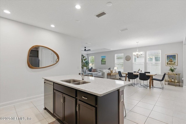 55 Cool Springs Ave, Ponte Vedra, FL 32081 - kitchen featuring an island with sink, a sink, stainless steel dishwasher, light tile patterned floors, and visible vents