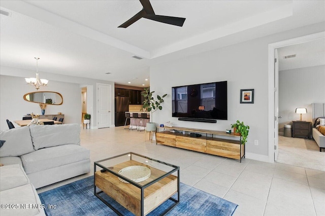 55 Cool Springs Ave, Ponte Vedra, FL 32081 - living area featuring light tile patterned floors, ceiling fan with notable chandelier, baseboards, and a raised ceiling