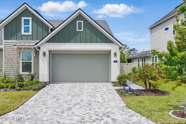 55 Cool Springs Ave, Ponte Vedra, FL 32081 - view of front of home featuring brick siding, decorative driveway, fence, and board and batten siding