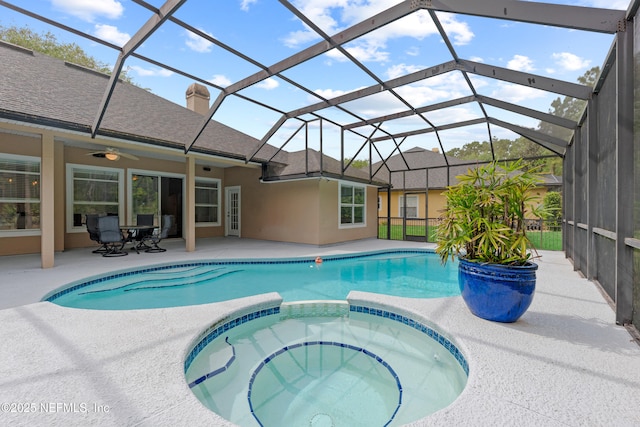 view of swimming pool featuring a lanai, a patio, a pool with connected hot tub, and a ceiling fan