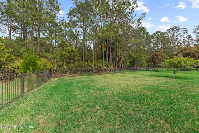 view of yard with fence