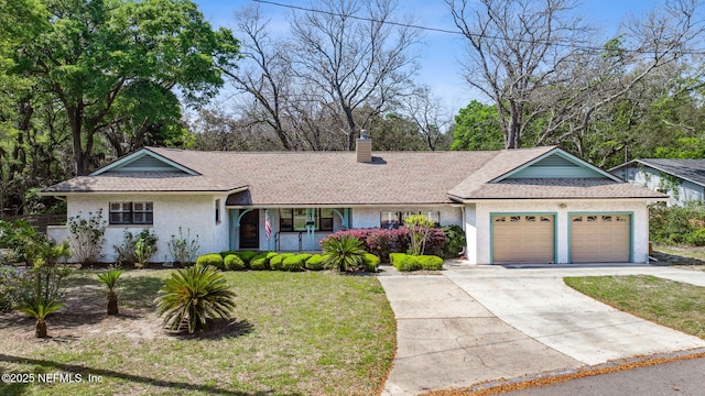 709 Amelia Dr, Fernandina Beach, FL 32034 - ranch-style home featuring concrete driveway, a chimney, stucco siding, an attached garage, and a front lawn