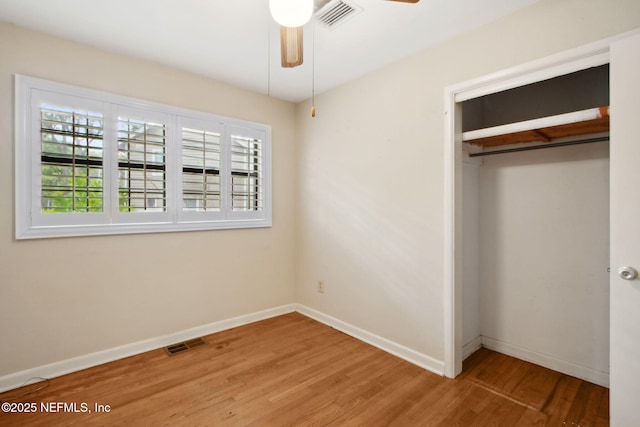 709 Amelia Dr, Fernandina Beach, FL 32034 - unfurnished bedroom with wood finished floors, baseboards, a closet, and visible vents