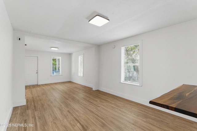 1539 7th St W, Jacksonville, FL 32209 - spare room with a wealth of natural light, light wood-type flooring, and baseboards