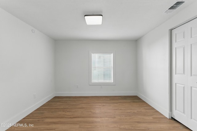1539 7th St W, Jacksonville, FL 32209 - empty room with baseboards, light wood-style flooring, and visible vents