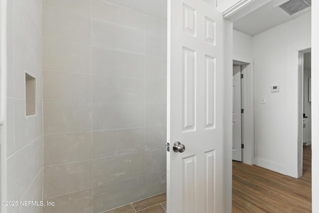 1539 7th St W, Jacksonville, FL 32209 - bathroom with wood finished floors, baseboards, and visible vents
