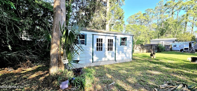 view of shed with fence