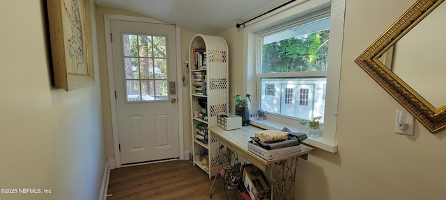 entryway with arched walkways, baseboards, wood finished floors, and lofted ceiling