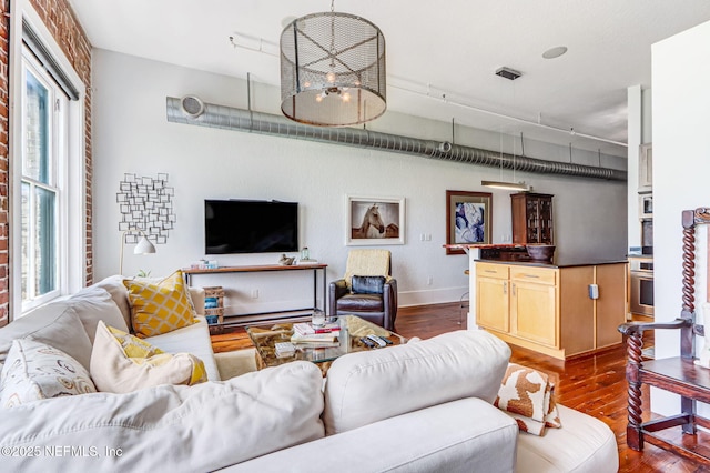 301 E Bay St Unit 405, Jacksonville, FL 32202 - living room featuring dark wood-style flooring and baseboards