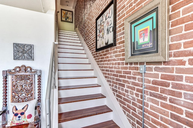 301 E Bay St Unit 405, Jacksonville, FL 32202 - staircase featuring brick wall