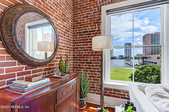 301 E Bay St Unit 405, Jacksonville, FL 32202 - bathroom featuring a view of city, brick wall, and vanity