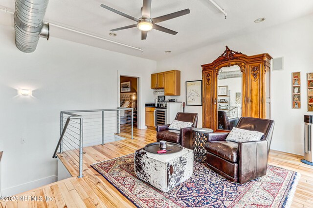 301 E Bay St Unit 405, Jacksonville, FL 32202 - living room featuring a ceiling fan, light wood-style floors, beverage cooler, and visible vents