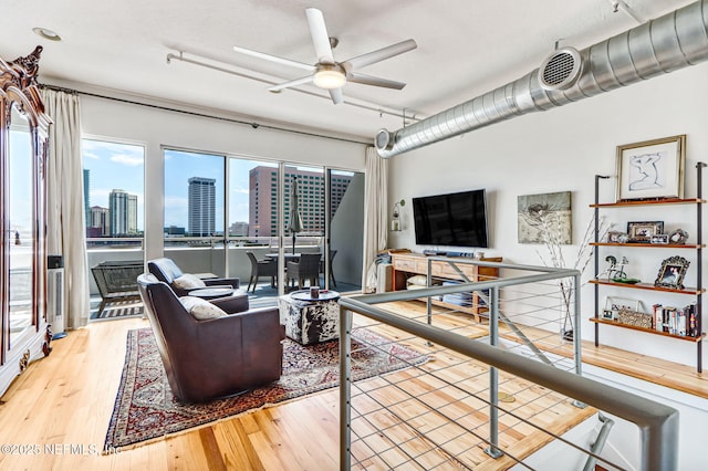 301 E Bay St Unit 405, Jacksonville, FL 32202 - living area featuring ceiling fan and wood finished floors