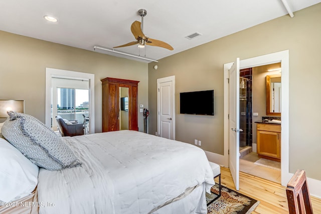 301 E Bay St Unit 405, Jacksonville, FL 32202 - bedroom featuring visible vents, ceiling fan, light wood-type flooring, recessed lighting, and ensuite bath