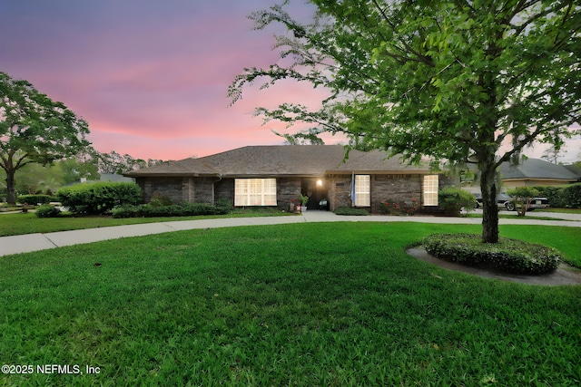 13233 Pecky Cypress Dr, Jacksonville, FL 32223 - ranch-style house with a lawn and stone siding