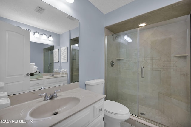 13233 Pecky Cypress Dr, Jacksonville, FL 32223 - bathroom with a shower stall, a textured ceiling, toilet, and vanity