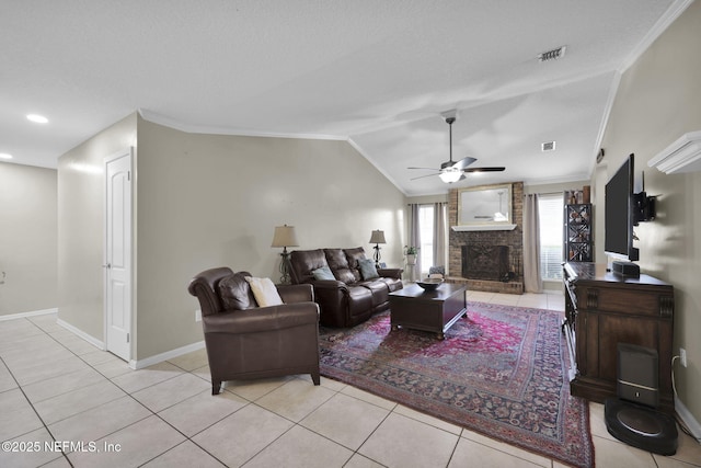 13233 Pecky Cypress Dr, Jacksonville, FL 32223 - living room featuring ceiling fan, crown molding, light tile patterned flooring, and a fireplace