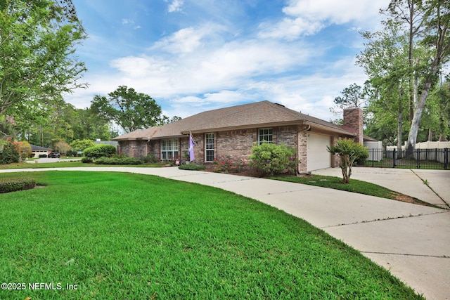 13233 Pecky Cypress Dr, Jacksonville, FL 32223 - ranch-style home with a front lawn, concrete driveway, fence, brick siding, and an attached garage