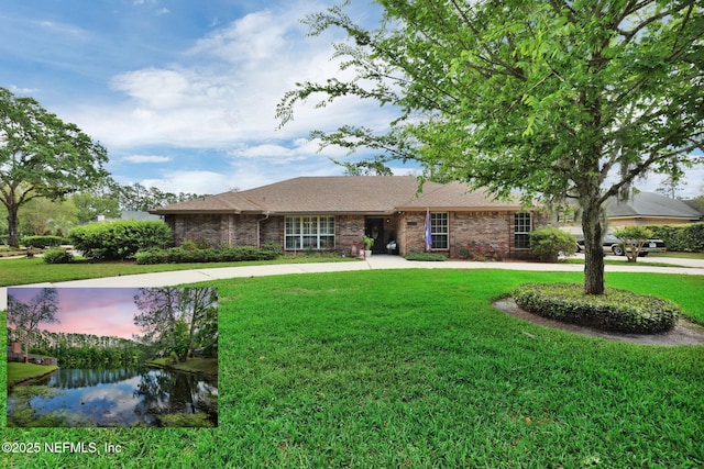 13233 Pecky Cypress Dr, Jacksonville, FL 32223 - ranch-style home with brick siding, a front yard, a shingled roof, and a water view