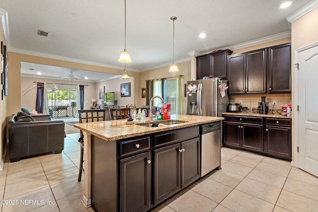 15943 Baxter Creek Dr, Jacksonville, FL 32218 - kitchen featuring open floor plan, light tile patterned floors, a sink, and appliances with stainless steel finishes