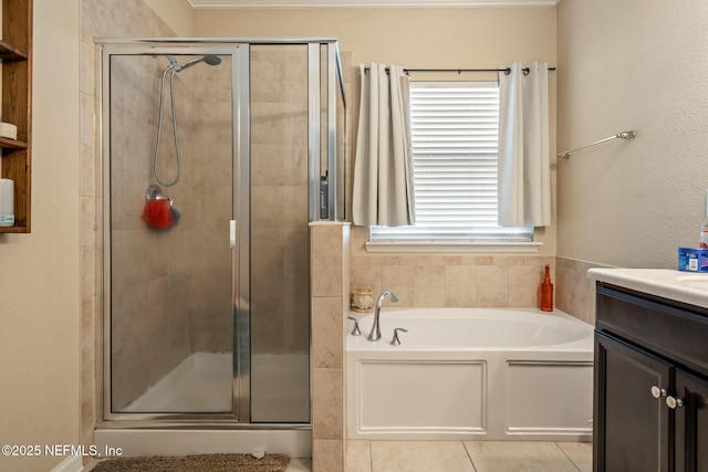 15943 Baxter Creek Dr, Jacksonville, FL 32218 - full bathroom with tile patterned floors, vanity, a stall shower, and a garden tub