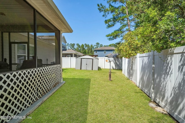15943 Baxter Creek Dr, Jacksonville, FL 32218 - view of yard featuring a fenced backyard, an outdoor structure, and a storage shed