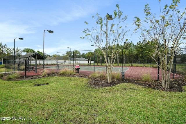 15943 Baxter Creek Dr, Jacksonville, FL 32218 - view of sport court with fence, a yard, and community basketball court
