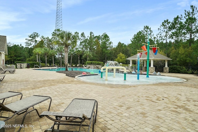 15943 Baxter Creek Dr, Jacksonville, FL 32218 - pool featuring a water play area and a patio area
