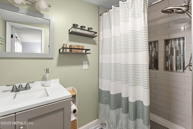 full bathroom with curtained shower and vanity