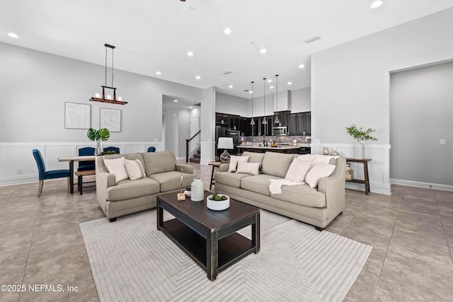 185 Calumet Dr, Saint Johns, FL 32259 - living area with a decorative wall, recessed lighting, stairway, and light tile patterned floors