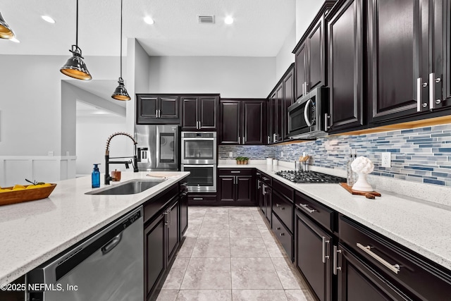 185 Calumet Dr, Saint Johns, FL 32259 - kitchen featuring a sink, stainless steel appliances, light stone counters, and visible vents