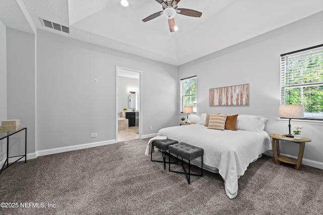 185 Calumet Dr, Saint Johns, FL 32259 - carpeted bedroom with baseboards, a raised ceiling, visible vents, a ceiling fan, and ensuite bathroom