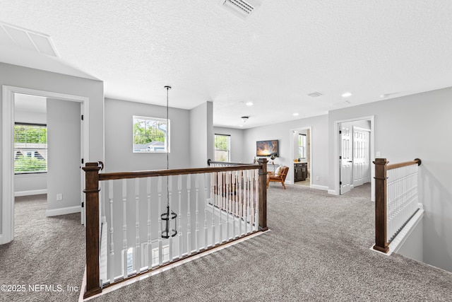 185 Calumet Dr, Saint Johns, FL 32259 - hall featuring baseboards, visible vents, an upstairs landing, and carpet floors