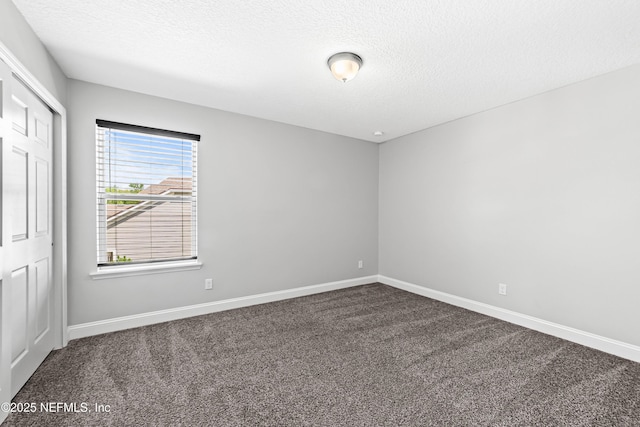 185 Calumet Dr, Saint Johns, FL 32259 - carpeted empty room with baseboards and a textured ceiling