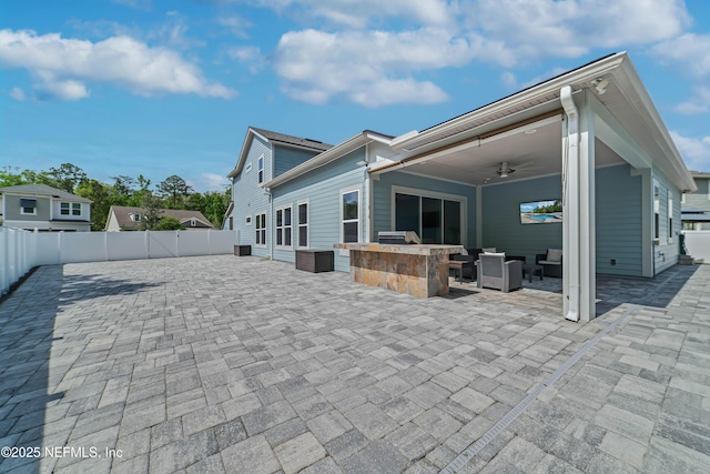 185 Calumet Dr, Saint Johns, FL 32259 - rear view of property featuring a patio, a fenced backyard, an outdoor living space, ceiling fan, and an outdoor kitchen