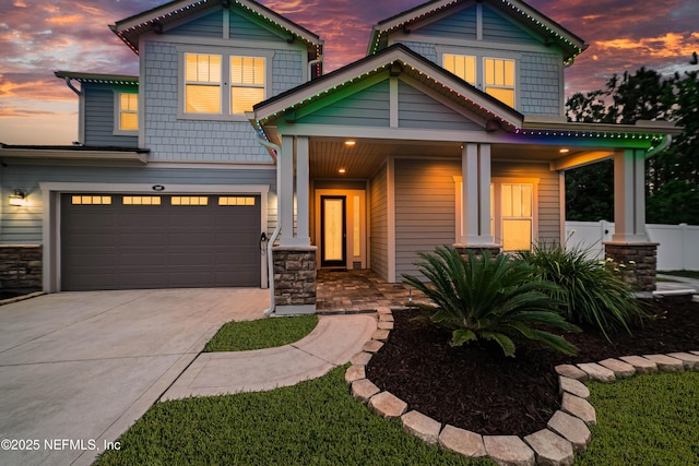 185 Calumet Dr, Saint Johns, FL 32259 - view of front of house featuring stone siding, driveway, a garage, and fence