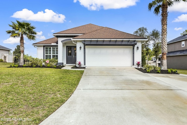 view of front of house featuring stucco siding, roof with shingles, a front lawn, a garage, and concrete driveway