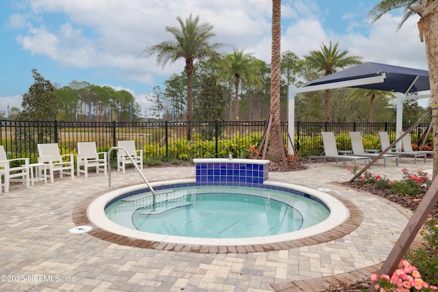 102 Fairlake Cir, Saint Augustine, FL 32092 - view of swimming pool featuring a community hot tub, fence, and a patio