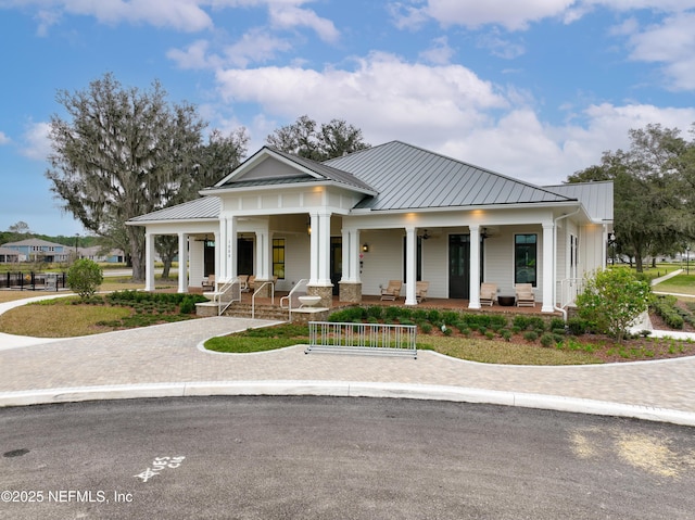 102 Fairlake Cir, Saint Augustine, FL 32092 - view of front of house featuring a porch, a ceiling fan, metal roof, and a standing seam roof