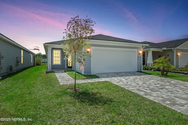 102 Fairlake Cir, Saint Augustine, FL 32092 - ranch-style home with an attached garage, a lawn, and decorative driveway