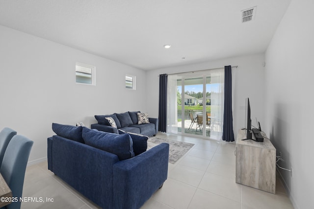102 Fairlake Cir, Saint Augustine, FL 32092 - living room with light tile patterned floors, baseboards, and visible vents