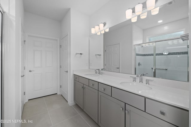 102 Fairlake Cir, Saint Augustine, FL 32092 - full bathroom with a shower stall, tile patterned floors, double vanity, and a sink