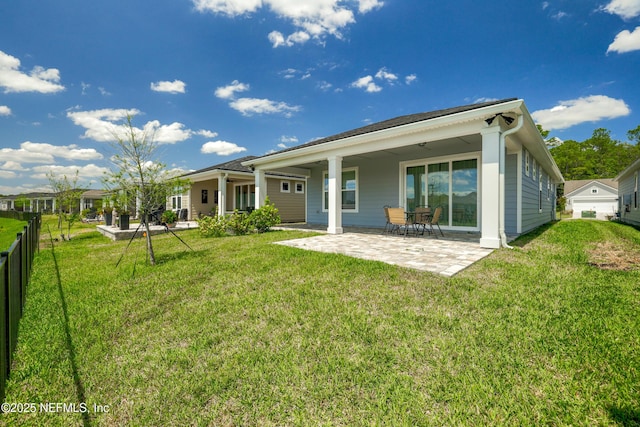 102 Fairlake Cir, Saint Augustine, FL 32092 - back of house featuring a patio area, fence, and a lawn