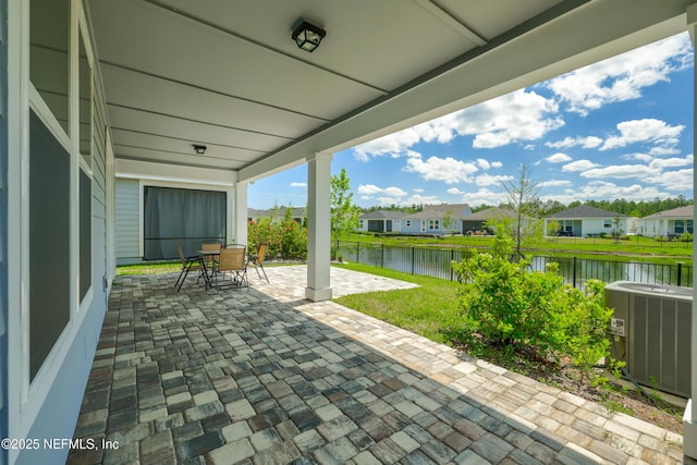 102 Fairlake Cir, Saint Augustine, FL 32092 - view of patio / terrace with a water view, a residential view, central air condition unit, and fence