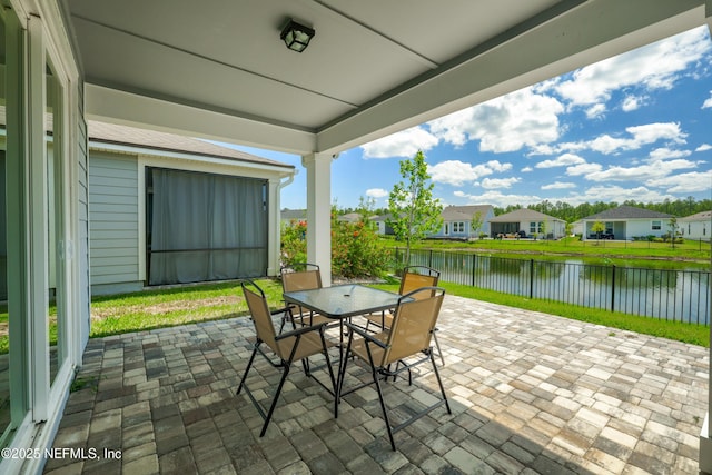 102 Fairlake Cir, Saint Augustine, FL 32092 - view of patio with a water view, a residential view, fence, and outdoor dining area